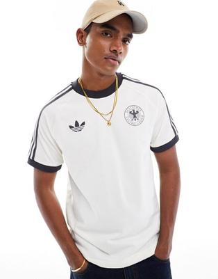 Oferta de Adidas Originals Germany Adicolour 3-stripes t-shirt in white por $55 en asos