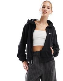 Oferta de Nike French Terry zip through hoodie in black por $64,99 en asos