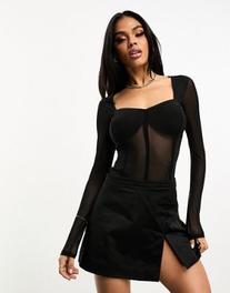 Oferta de ASOS DESIGN mesh mix bodysuit with corset seams in black por $29,99 en asos